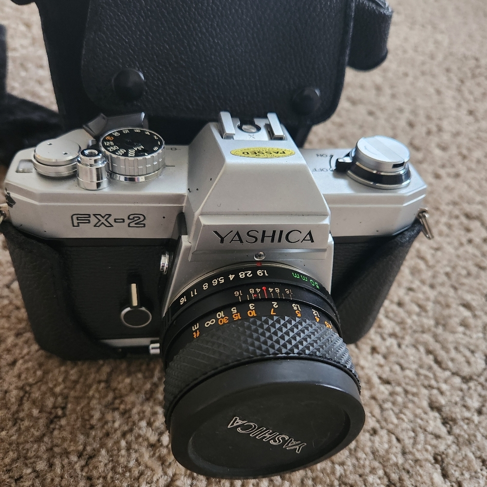 Yashica FX-2 35mm Film Camera with detached flash and carrying case